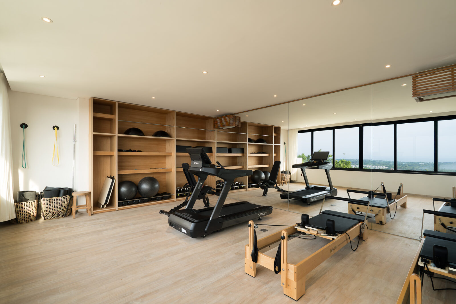 The gym at Maison Ulu Satu, with two reformer Pilates machines.